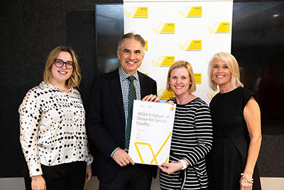 Hatch receives the Employer of Choice for Gender Equality accreditation from Libby Lyons, director of the Workplace Gender Equality Agency. From left, Catherine Robinson, Jan Kwak, and Rowena Gamble from Hatch with Libby Lyons, WGEA.