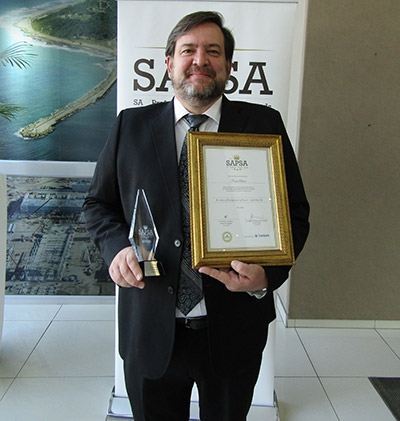 Pierre Olivier accepts the award for Engineering Professional of the Year from the South African Professional Services Awards