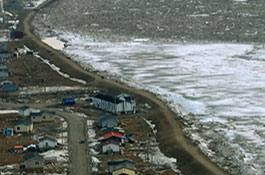 A stabilizing berm holds off ice and water from overflowing into the Kashechewan First Nation thumbnail